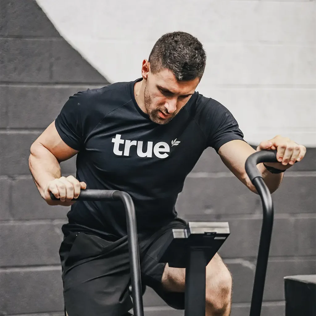 a photo of a man exercising on an airbike