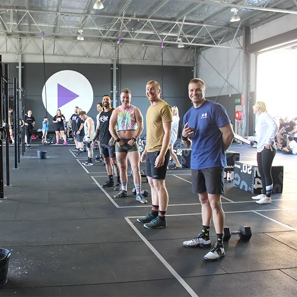 a group photo of men standing in line